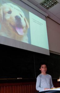 Boy giving presentation on puppies