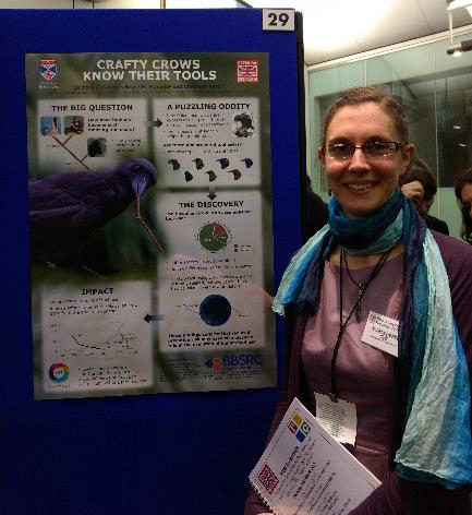 Barbara Klump next to her poster "Crafty crows know their tools"